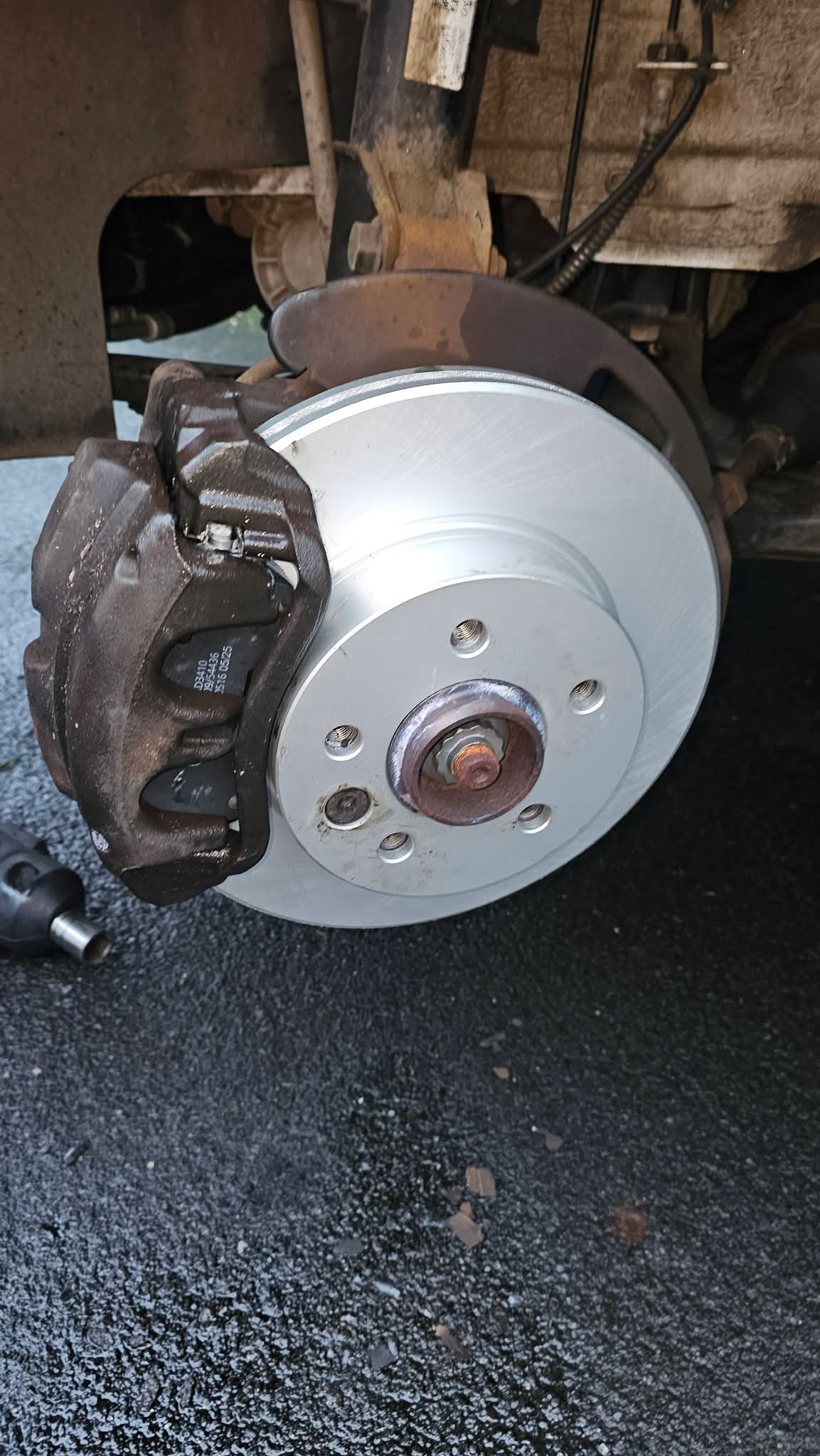 Brake and suspension work on driveway